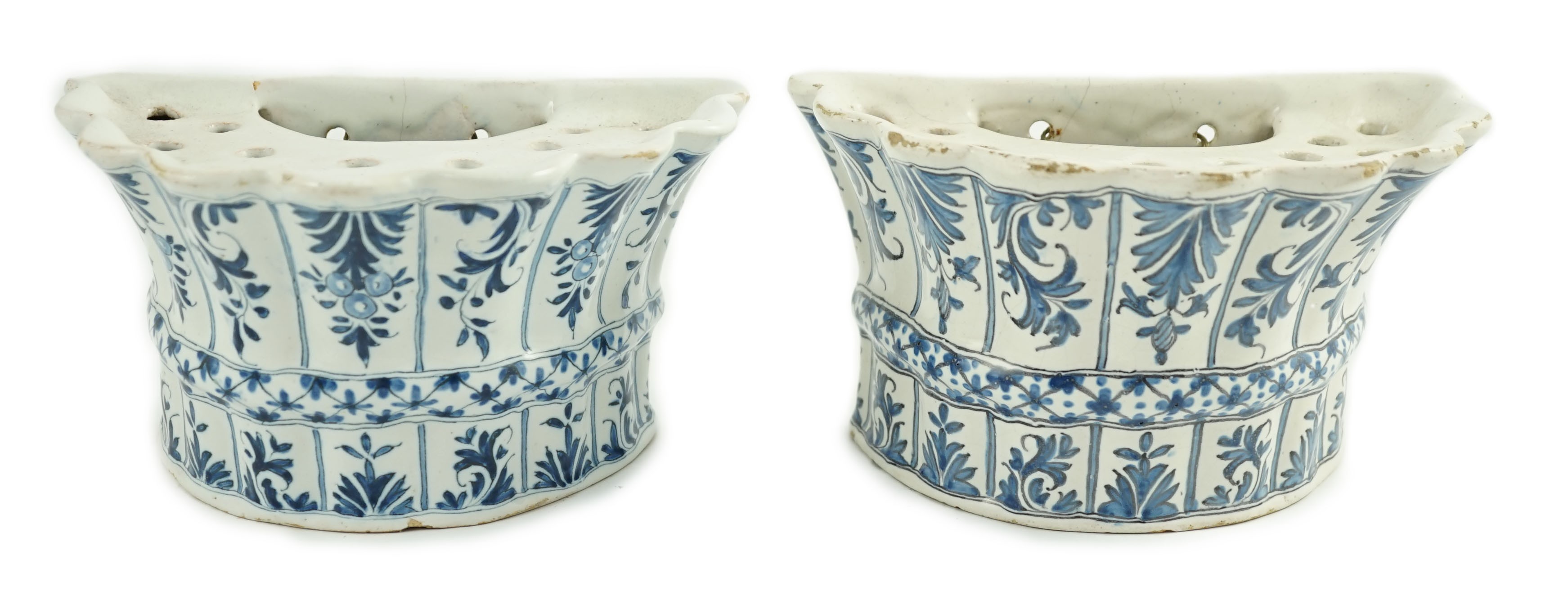 Two similar 18th century Delft blue and white hanging bough pots, 18.3cm wide
